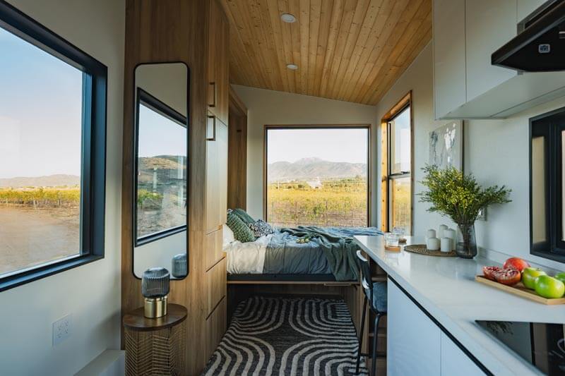 bedroom with large windows in an ADU at a vineyard